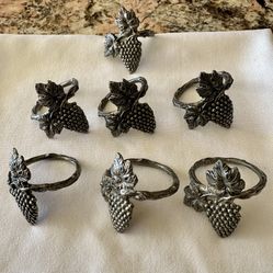 Set of 7 matching Pewter Napkin rings featuring a detailed grape cluster and Leaves 