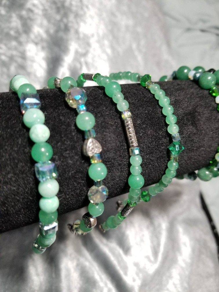 Assorted green gemstone bracelets (green adventurine and jade with czech glass and Swarovski beads).
Size small.
Clasp closure and stretch available.