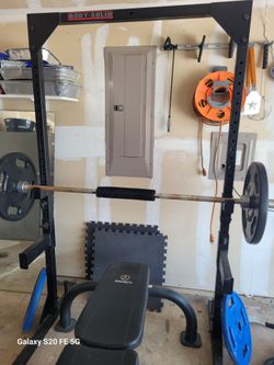 Squat rack, Bench and Bar.  WEIGHT PLATES ARE NOT INCLUDED