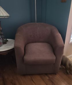 Brown suede swivel barrel chair
