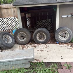 Tire 31 x10, 50R15lT.  $200 Wheels And Tires.