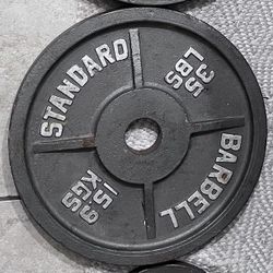 (2) 35lb Plates / (2) 5lb Plates / Adjustable Squat Stand / 2” Olympic Barbell / Set Of 2” Barbell Clips 