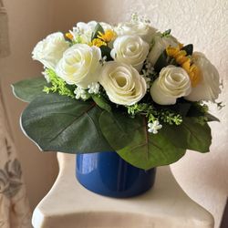 Handmade Artificial Floral Arrangement: 24 White Roses And Assorted Yellow , Green Leaves, Navy Blue Glass Vase , 18cm Wide X 11 cm High .