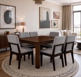 Dark Wood Dining Table with 8 Gray Upholstered Chairs