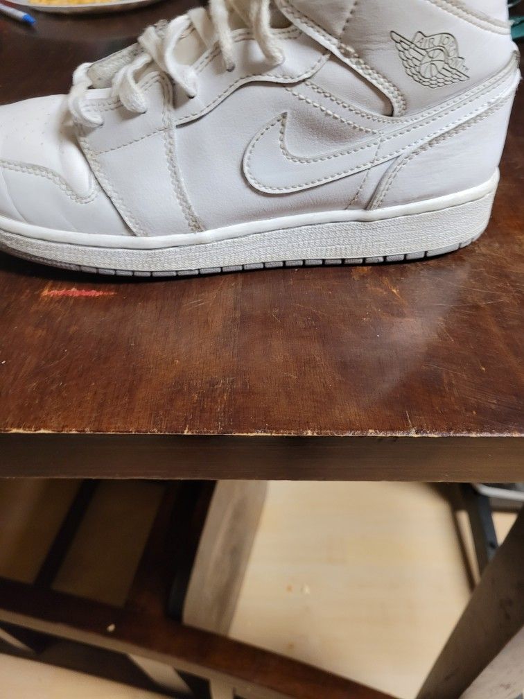 White Nike Air Jordan 1s