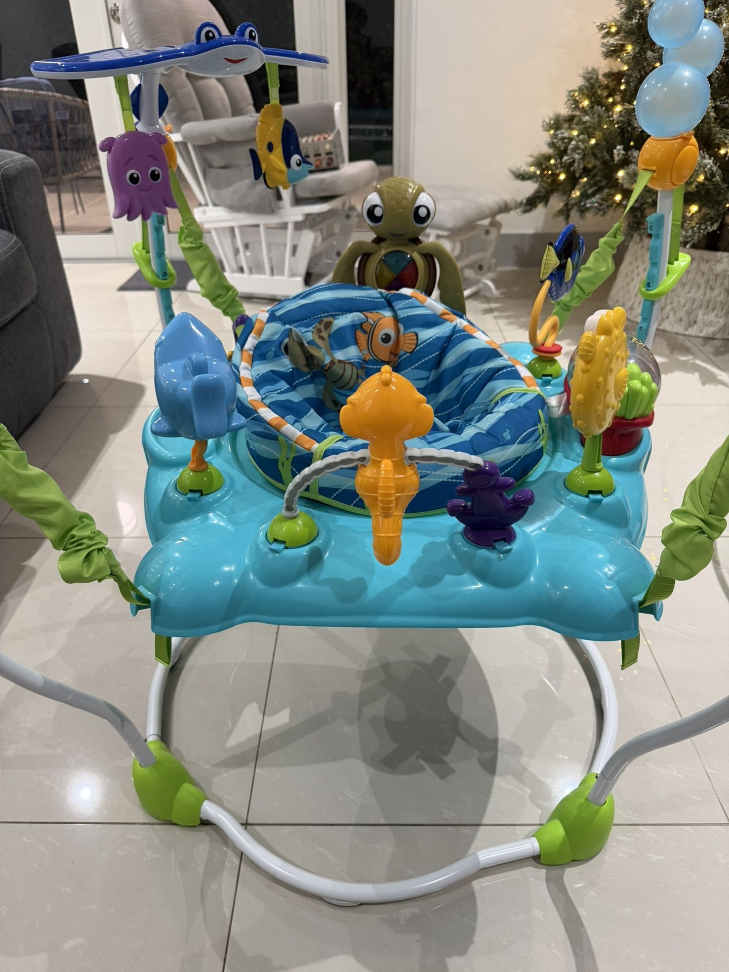 Bright Starts Disney Baby Finding Nemo Sea of Activities Baby Activity Center Jumper with Interactive Toys, Lights, Songs & Sounds, 6-12 Months (Blue)