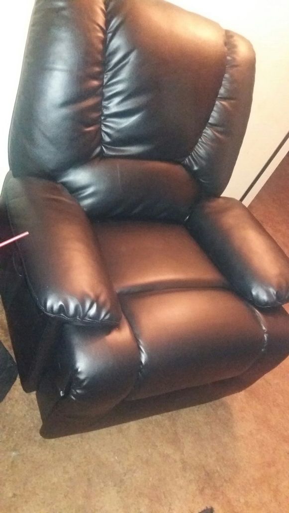 Two leather recliners in new condition