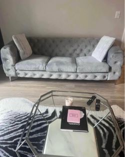 Gray living room set includes couch and coffee table
