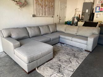 Large light gray fabric sectional sofa in excellent condition