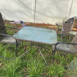A Nice Patio Table, With Two Big Patio Chairs