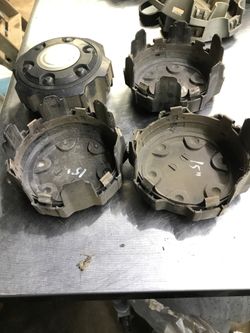 Toyota Center caps. One missing two tabs.