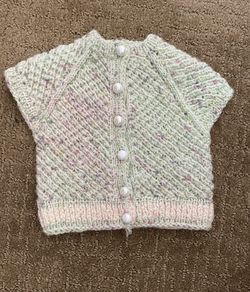 Knitted baby girl clothes