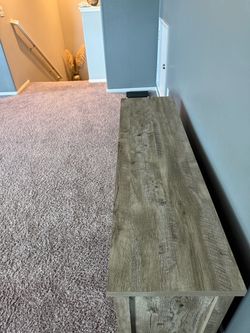 Wood stain farmhouse-style sliding barn-door TV stand