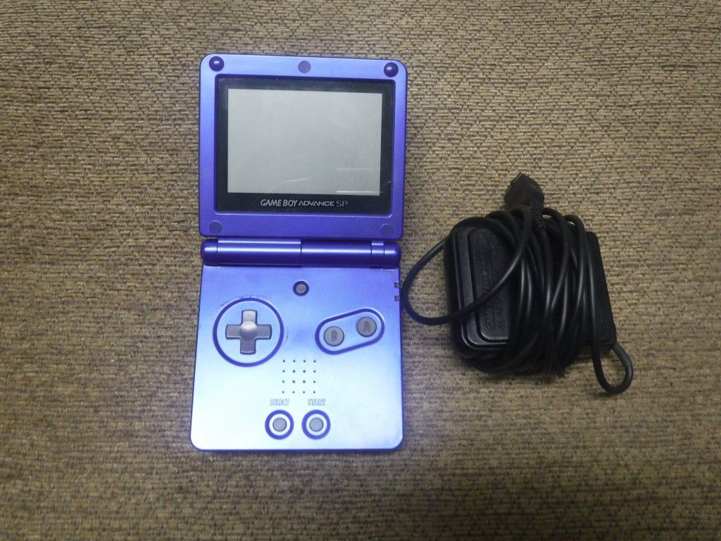A clean Nintendo Game Boy Advance SP Gameboy with charger