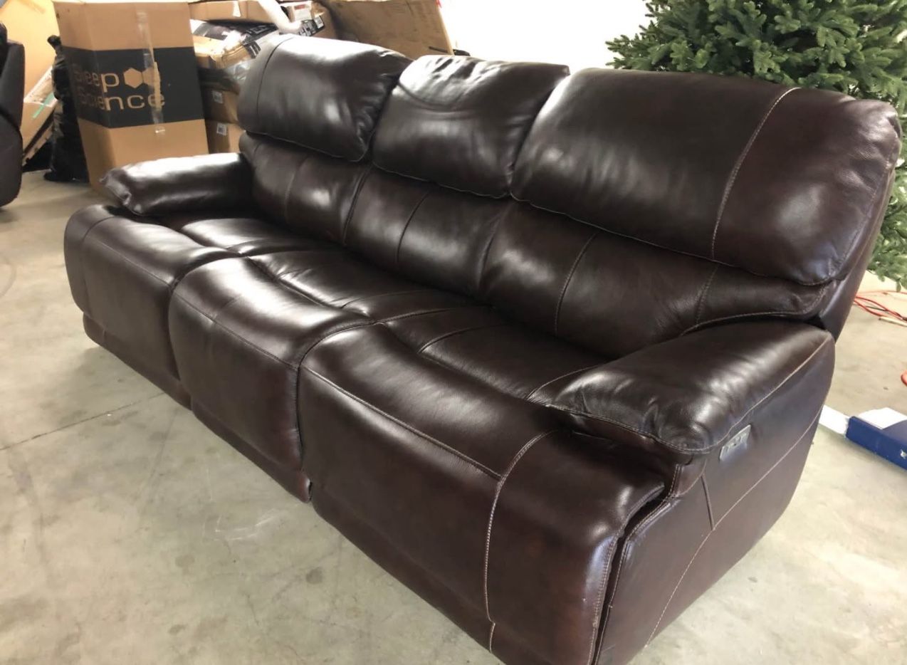 Aleena Leather Power Reclining Sofa with Power Headrest Retails over $800 Previous floor model, still like new Small scuff (see last pic) on top back