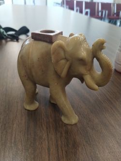 Elephant 4x4" decor candle holder

Great shape. Normal wear. Heavy! Vintage.