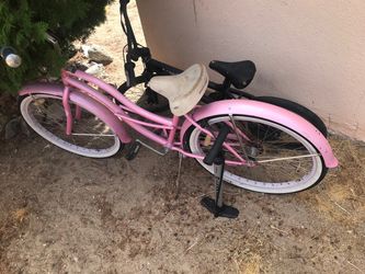 Pink Beach Cruiser And Black BMX