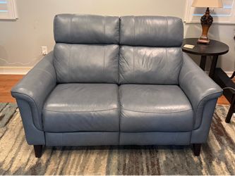 Blue leather love seat