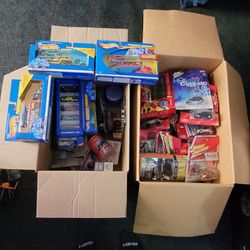 Two Boxes Of Brand New Cars 