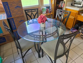Glass and metal dining room table with 4 chairs