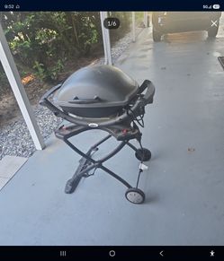 Weber Q 2400 electric grill,and stand (300 dollar value with stand)