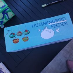 Blown glass hummingbird feeder