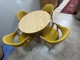 4 upholstered chairs and round table