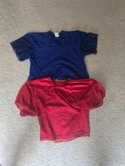 2 football practice jerseys (used) great shape. For ages 7-13 youth med/Lg