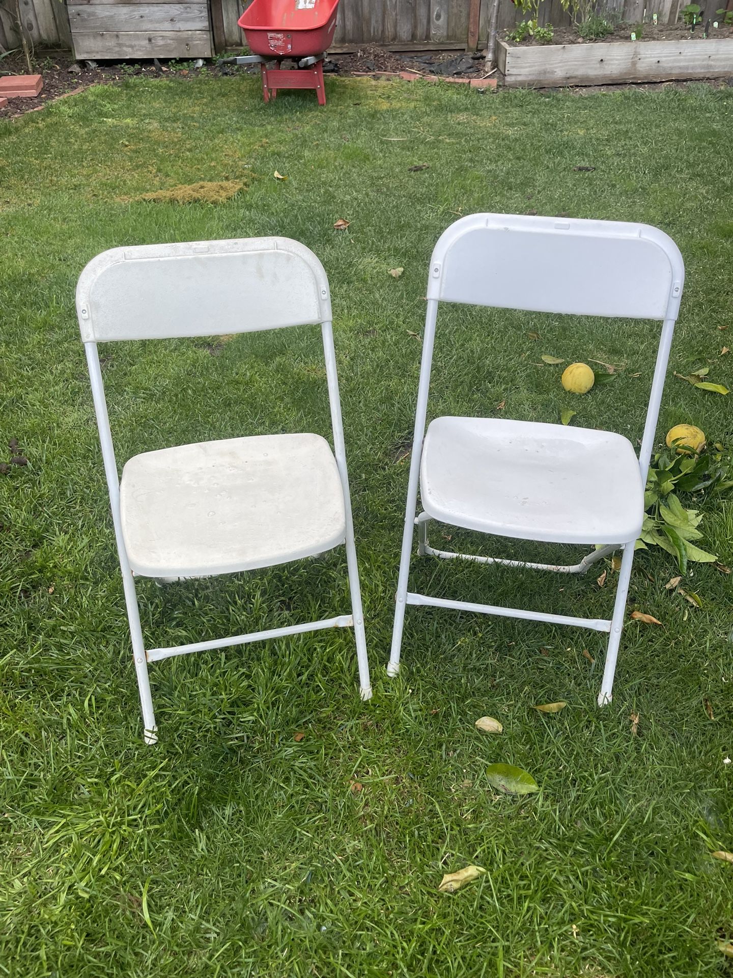 2 White foldable chairs—L@@k 