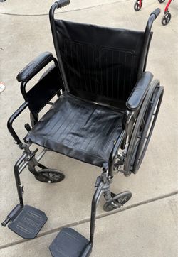 Black Manual Wheelchair with Footrests