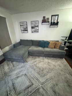 Jerome’s Furniture "Dreamscape" 2-Piece Fabric Sectional Sofa with a Left-Facing Chaise in Charcoal Gray.