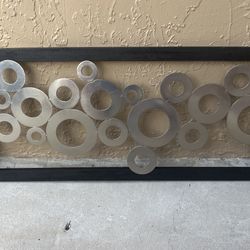 The wall decor can be either horizontal or vertical.