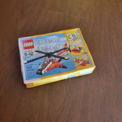 LEGO Creator Air Blazer 31057 Kids New 3-in-1 Helicopter Seaplane Set 
New sealed. Box slightly DENTED, SHOWS SOME SHELF WEAR, BUT STILL SEALED 
- ple