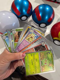 Pokemon card bulk with tin and pokeballs