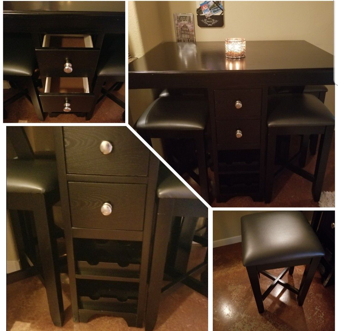 Small table, 4 stools, 4 drawers and 8 wine holders at the bottom.