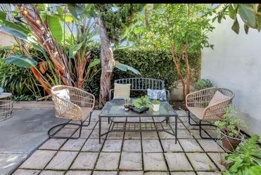 Two patio chairs — wicker style
