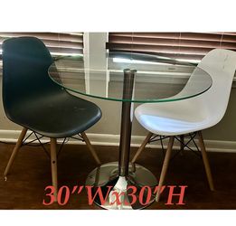 Glass table with two chairs