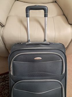 Samsonite U.S.A. Travel Luggage Carry On, Expandable Measuring 21" x 13" x 7" in a Classic Dark Gray Color.