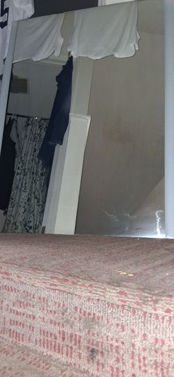 Frameless wall mounted mirror with LED light