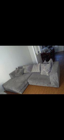 Grey sectional couch , with love seat . Still in great condition!