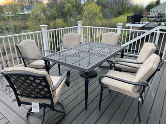 Outdoor table, umbrella and chairs