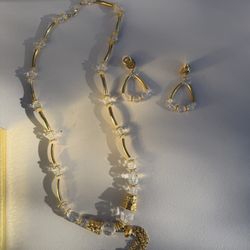 vintage Trifari necklace and earring set featuring gold-tone components and clear beads 