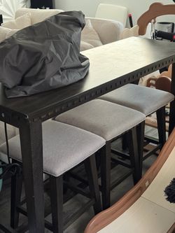 Bar height table with stools