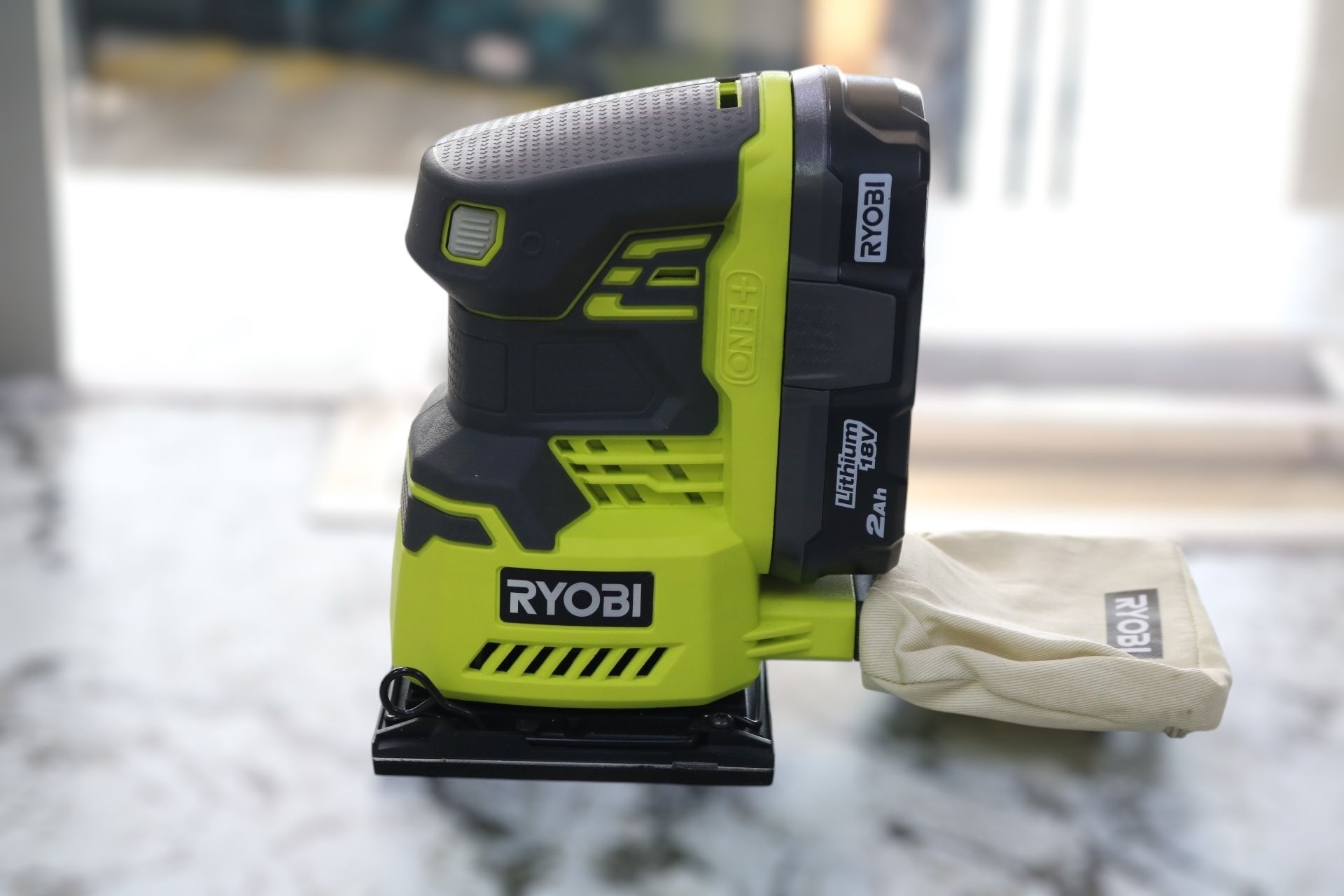 Ryobi P440 Sheet Palm Sander with a Ryobi P190 One+ 18V Battery