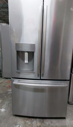 Stainless GE Fridge with LED Lighting and Water Dispenser