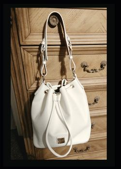 Dooney & Bourke Lucca Pebble Leather Drawstring Shoulder Bucket Bag. MSRP- $348. Color- White.