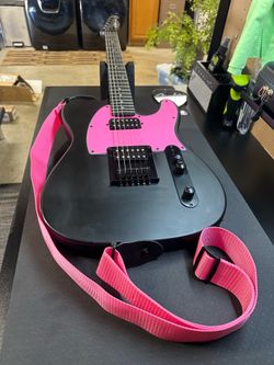 Harley Benton electric guitar with guitar strap