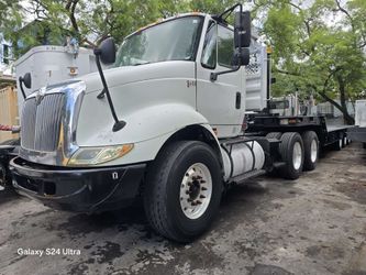2005 INTERNATIONAL DAY CAB TANDEM AXLE TRUCK WITH WET LINE KIT & HEADACHE RACK