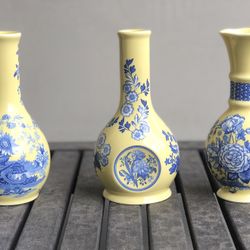 Small yellow and blue floral vases