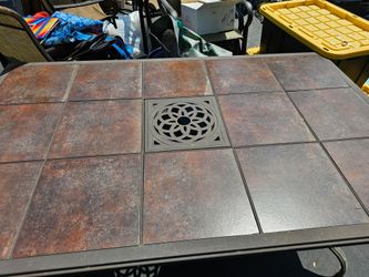 patio chairs and tile top table